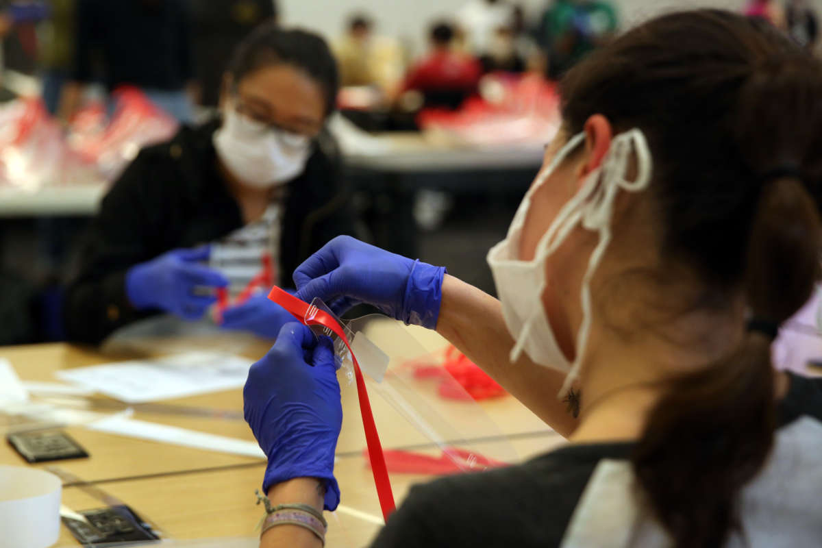 UCLA students and other volunteers make face shields to help support doctors on the frontlines of the coronavirus pandemic who may not have enough PPE at Geffen Hall UCLA on April 19, 2020, in Los Angeles, California.