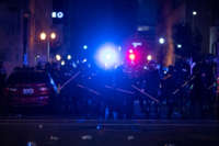 Police in riot gear stand in formation during protests on May 29, 2020, in Louisville, Kentucky.