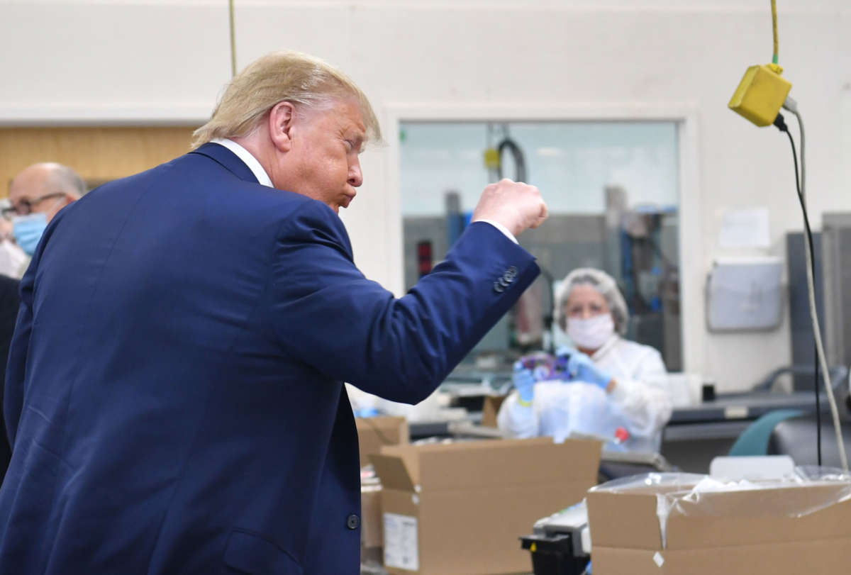 President Trump gestures during his visit of the Puritan Medical Products facility in Guilford, Maine, on June 5, 2020.