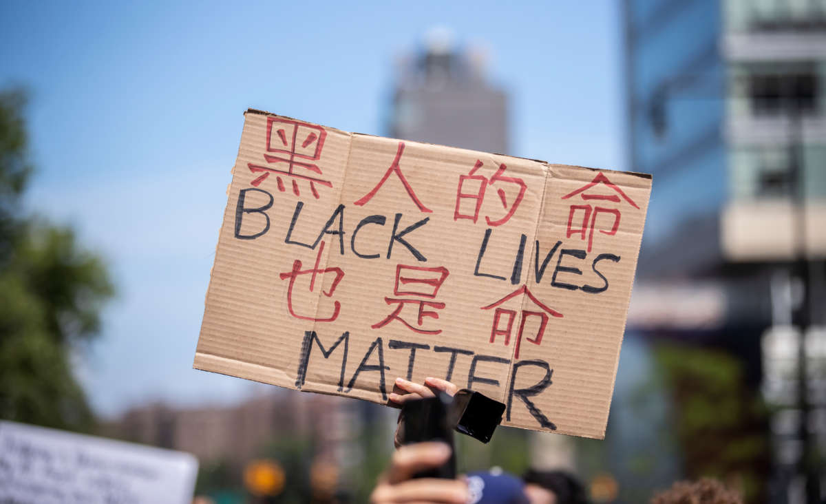 A protester holds up a homemade "Black Lives Matter" sign during a Juneteenth rally on June 19, 2020 in New York City.