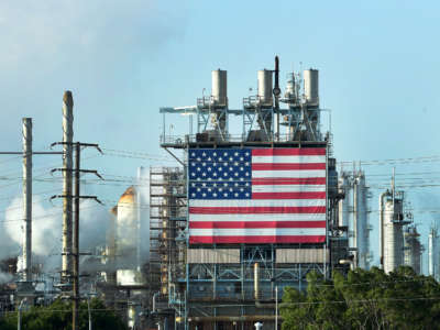 The US flag is displayed at the Wilmington Oil Fields south of Los Angeles, California, on April 21, 2020, a day after oil prices dropped to below zero.