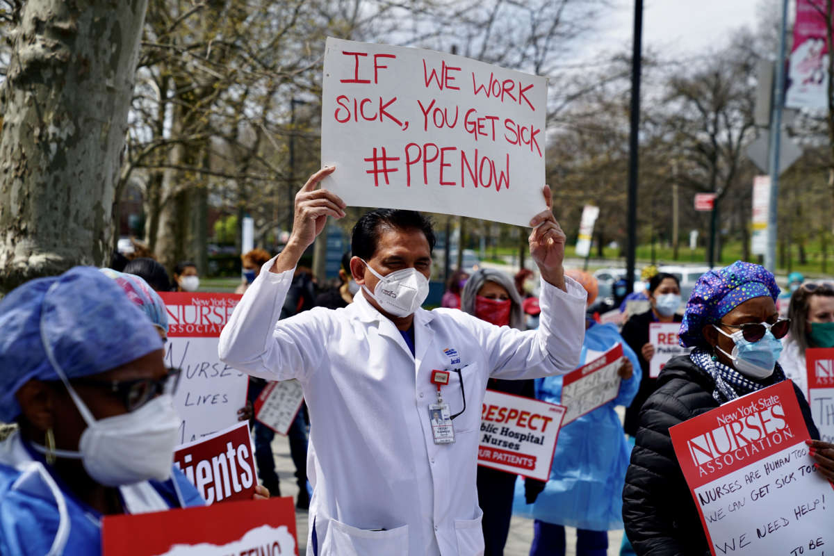 Public health workers, doctors and nurses protest over lack of sick pay and personal protective equipment outside a hospital in the borough of the Bronx on April 17, 2020, in New York City.