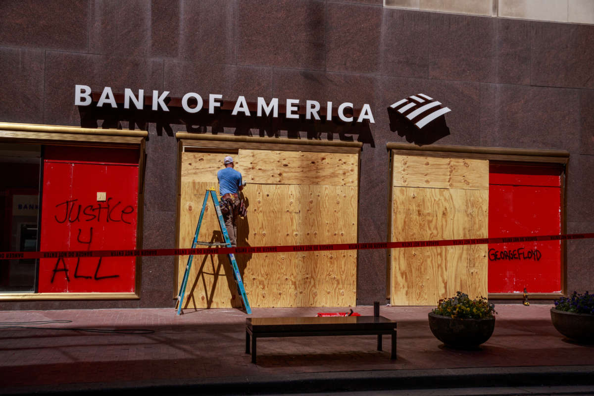 A Bank of America branch is boarded up in downtown after protests began against the police killing of George Floyd and Sean Reed in Indianapolis.
