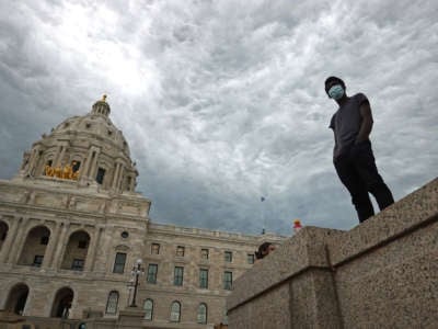 A man stands outside of the Minneapolis capital building as unrest continues around the country following the death of George Floyd on June 2, 2020, in St. Paul, Minnesota.