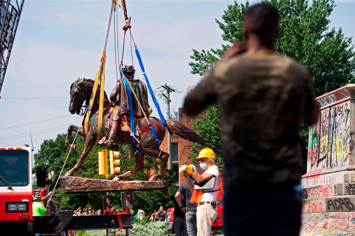 The statue of Confederate General J.E.B. Stuart is removed from Monument Avenue in Richmond, Virginia on July 7, 2020.