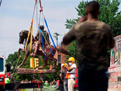 The statue of Confederate General J.E.B. Stuart is removed from Monument Avenue in Richmond, Virginia on July 7, 2020.