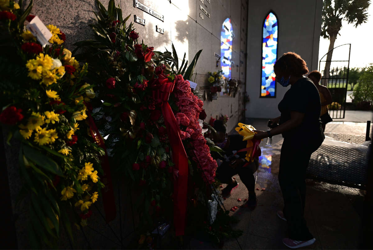 A woman stands at the burial site of George Floyd in the Houston Memorial Gardens cemetery in Pearland, Texas, on June 9, 2020.