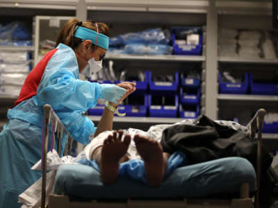 A nurse evaluates a patient that had just been admitted to the emergency room at Regional Medical Center on May 21, 2020, in San Jose, California.