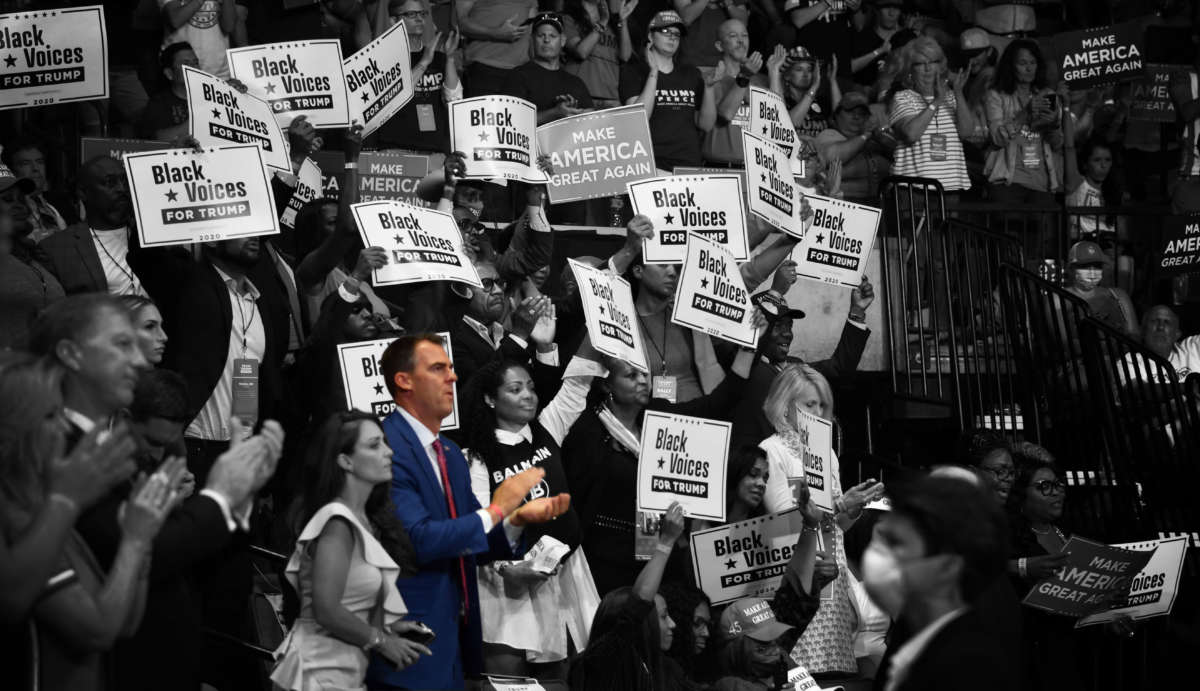 Gov. Kevin Stitt claps as President Trump speaks during a campaign rally at the Bank of Oklahoma Center on June 20, 2020, in Tulsa, Oklahoma.