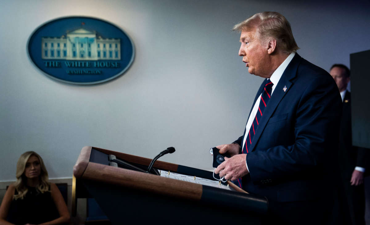 President Trump holds his face mask as he speaks during a COVID-19 briefing in the James S. Brady Briefing Room at the White House on July 21, 2020, in Washington, D.C.