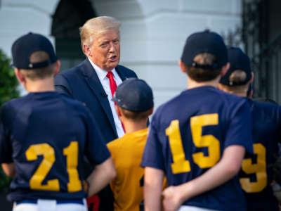 President Trump talks with youth baseball players on the South Lawn of the White House on July 23, 2020, in Washington, D.C.