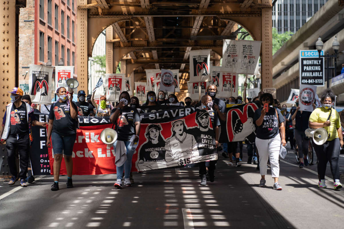 Fast food workers and supporters march during a national workers strike in the Loop in Chicago, Illinois, on July 20, 2020.