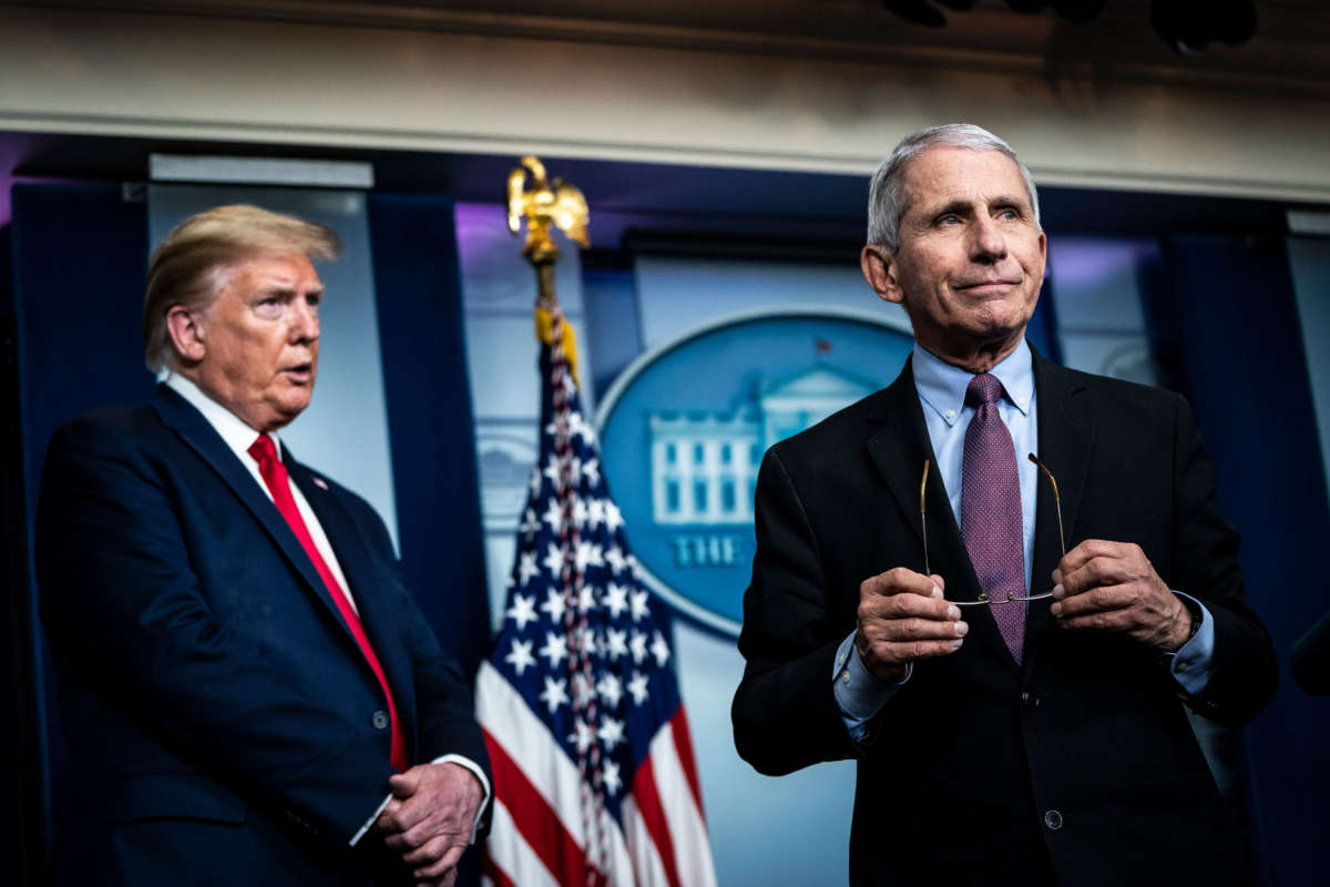 President Trump listens as Dr. Anthony Fauci, director of the National Institute of Allergy and Infectious Diseases, speaks with members of the coronavirus task force during a briefing in the James S. Brady Press Briefing Room at the White House on April 22, 2020, in Washington, D.C.