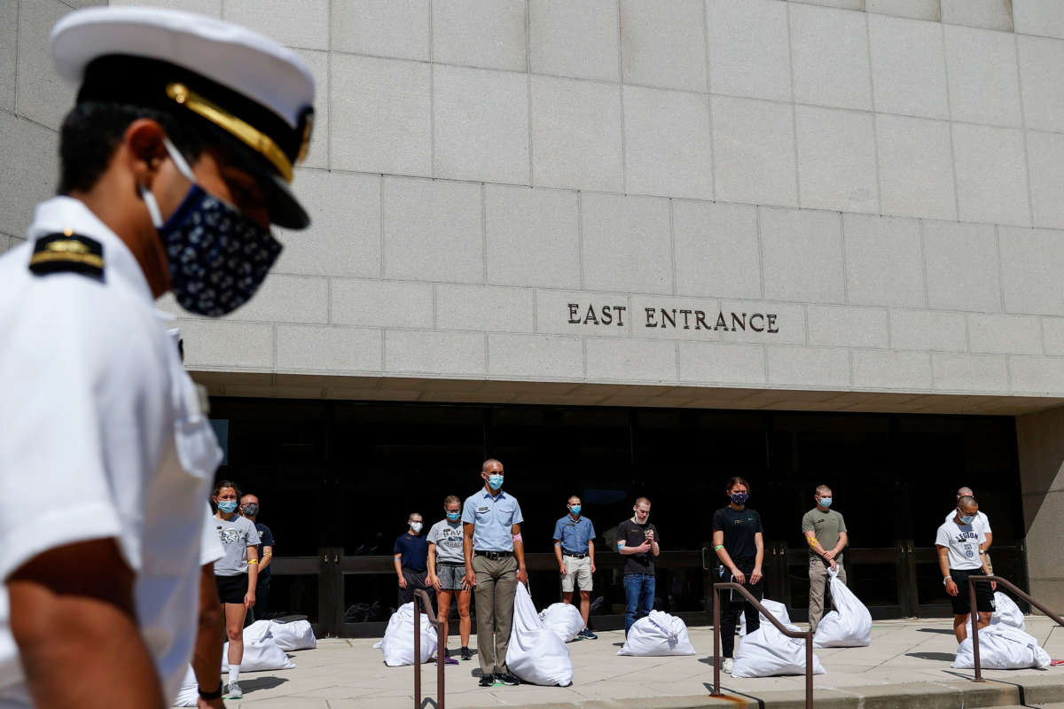 Plebes wait to receive instruction from a Midshipman on Induction Day on June 30, 2020, at the U.S. Naval Academy in Annapolis, Maryland.