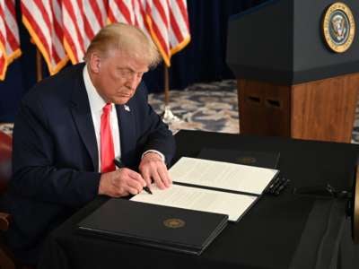Donald Trump signs an executive order