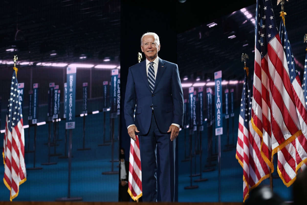 Former vice-president and Democratic presidential nominee Joe Biden stands on stage at the end of the third day of the Democratic National Convention, at the Chase Center in Wilmington, Delaware, on August 19, 2020.