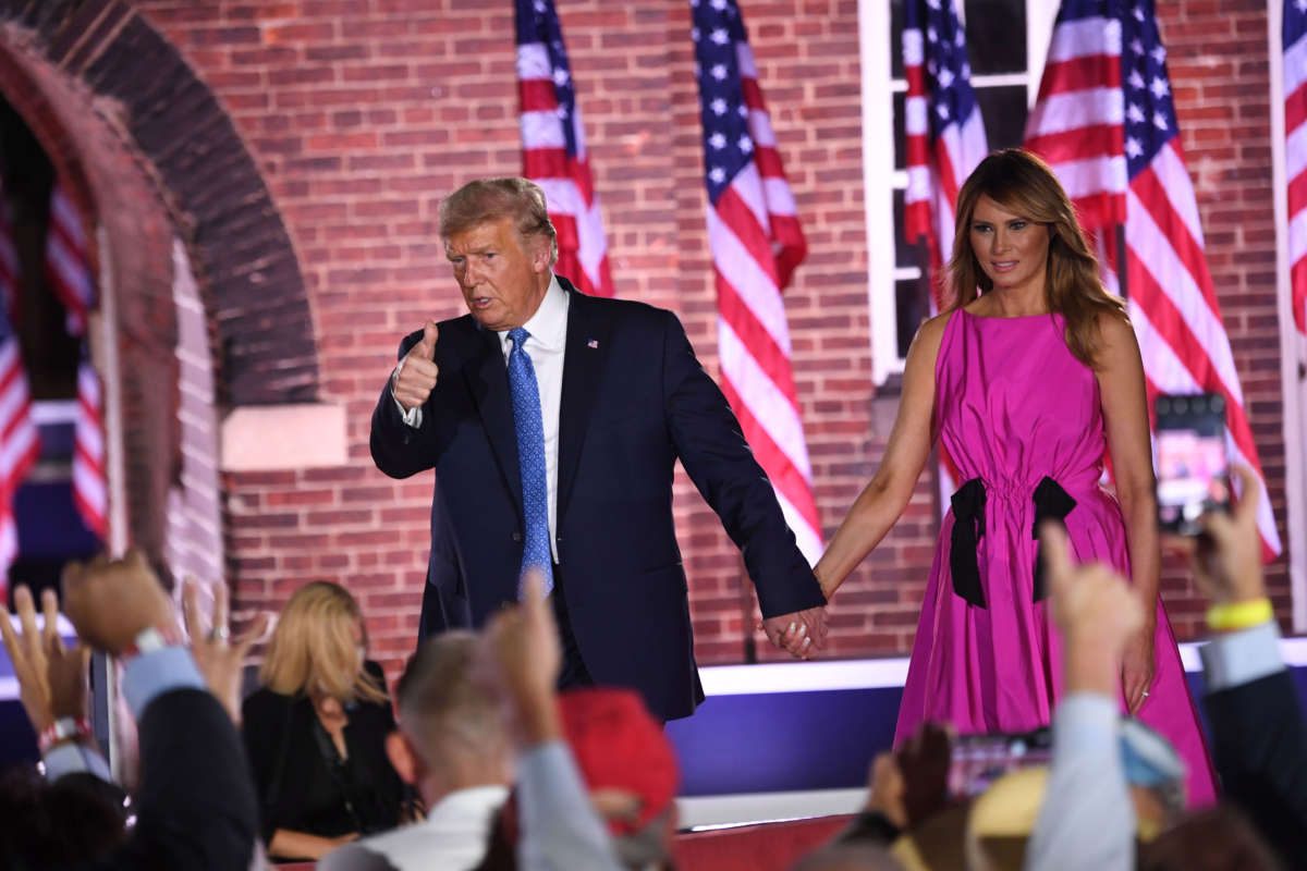 President Trump holds hands with First Lady Melania Trump at the conclusion of the third night of the Republican National Convention at Fort McHenry National Monument in Baltimore, Maryland, August 26, 2020.