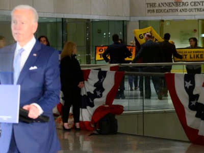 Climate activists briefly protest as former Vice President Joe Biden delivers remarks at the National Constitution Center in Philadelphia, Pennsylvania, on March 10, 2020.