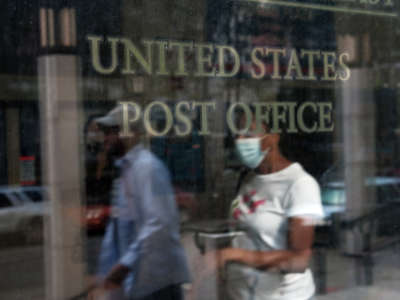 People enter a Brooklyn Post Office on August 5, 2020, in New York City.