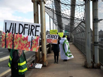 Activists for climate action walk along the George Washington Bridge from New York City to New Jersey on January 26, 2020.