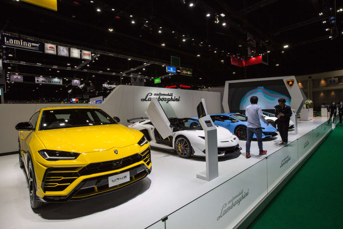 A Lamborghini Urus car (left) along with other Lamborghini car models seen at the Lamborghini stand during the 41st Bangkok International Motor Show 2020 on July 15, 2020.
