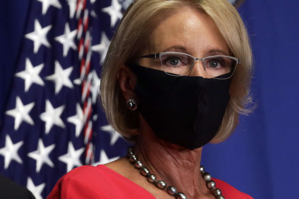 Secretary of Education Betsy DeVos listens during a White House Coronavirus Task Force press briefing at the U.S. Department of Education on July 8, 2020, in Washington, D.C.