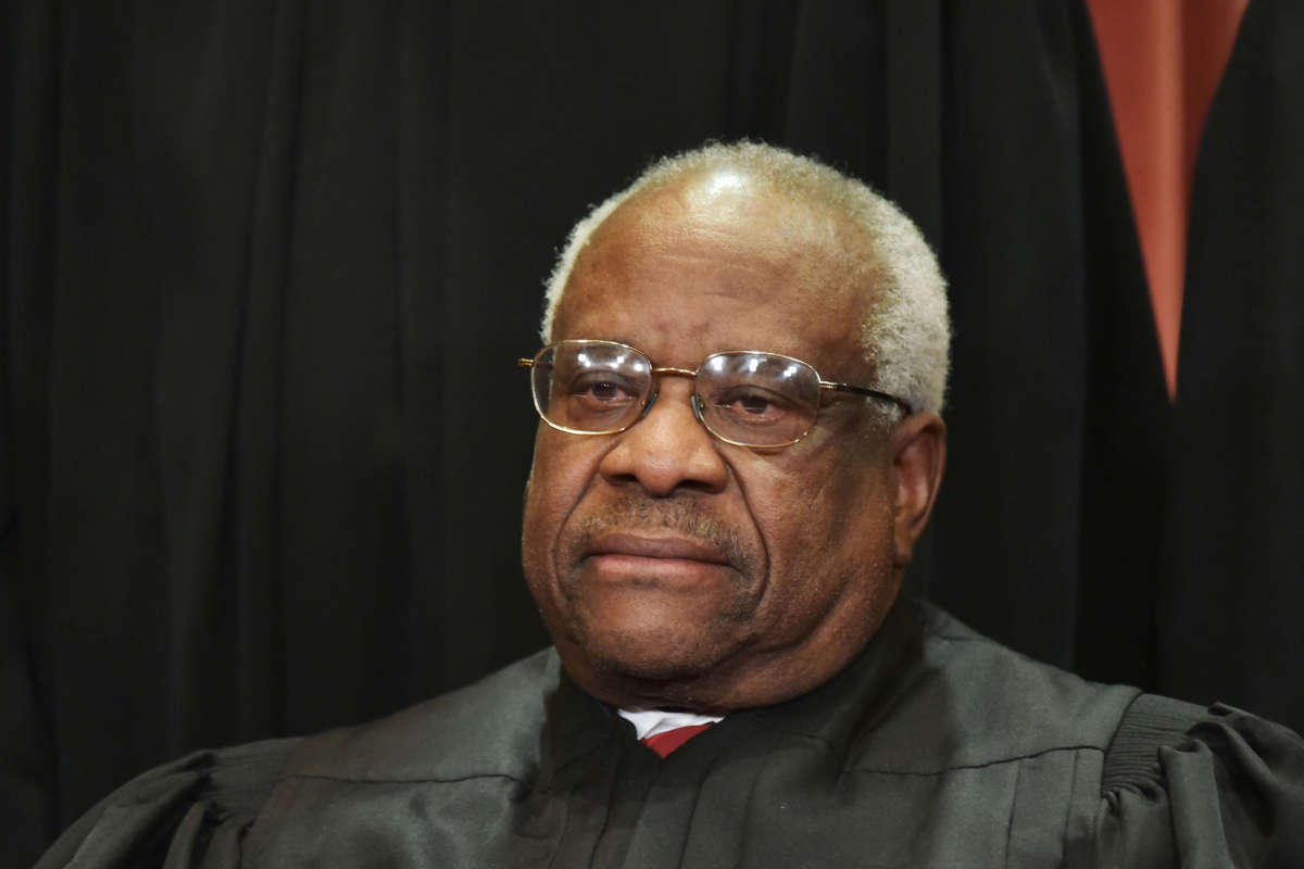 Associate Justice Clarence Thomas poses for the official group photo at the U.S. Supreme Court in Washington, D.C., on November 30, 2018.