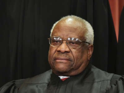 Associate Justice Clarence Thomas poses for the official group photo at the U.S. Supreme Court in Washington, D.C., on November 30, 2018.