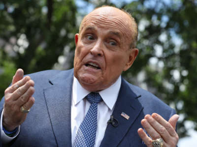 President Trump's lawyer Rudy Giuliani talks to journalists outside the White House West Wing, July 1, 2020, in Washington, D.C.
