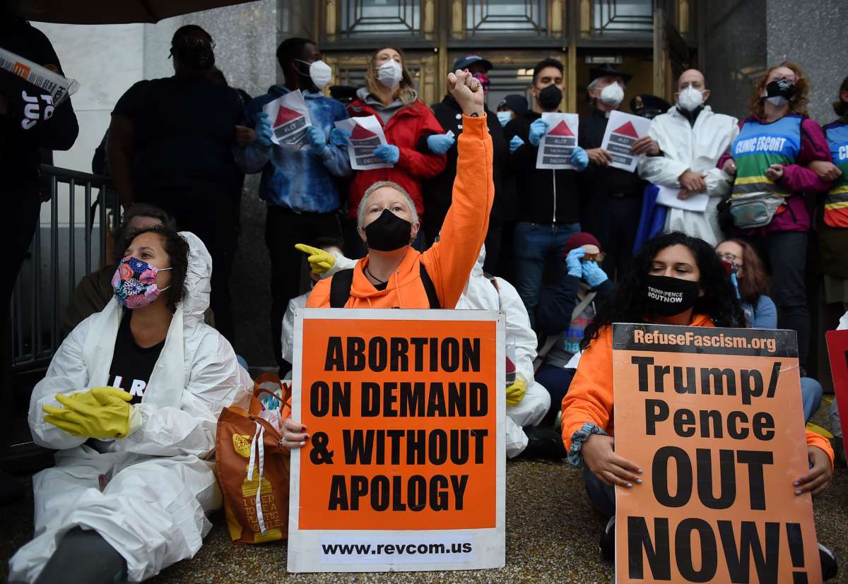 Protesters block the entrance of Hart Senate Office Building on the first day of the nomination hearing for President Donald Trump's Supreme Court nominee, Amy Coney Barrett on October 12, 2020, in Washington, D.C.