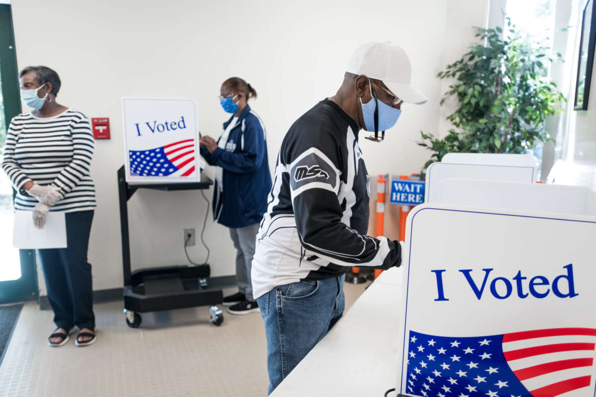 People cast ballots at the Richland County Voter Registration and Elections Office on the second day of in-person absentee and early voting on October 6, 2020, in Columbia, South Carolina.