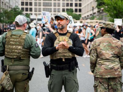 Drug Enforcement Administration police are seen as demonstrators march to Freedom Plaza from Capitol Hill to honor George Floyd and victims of racial injustice on June 6, 2020.