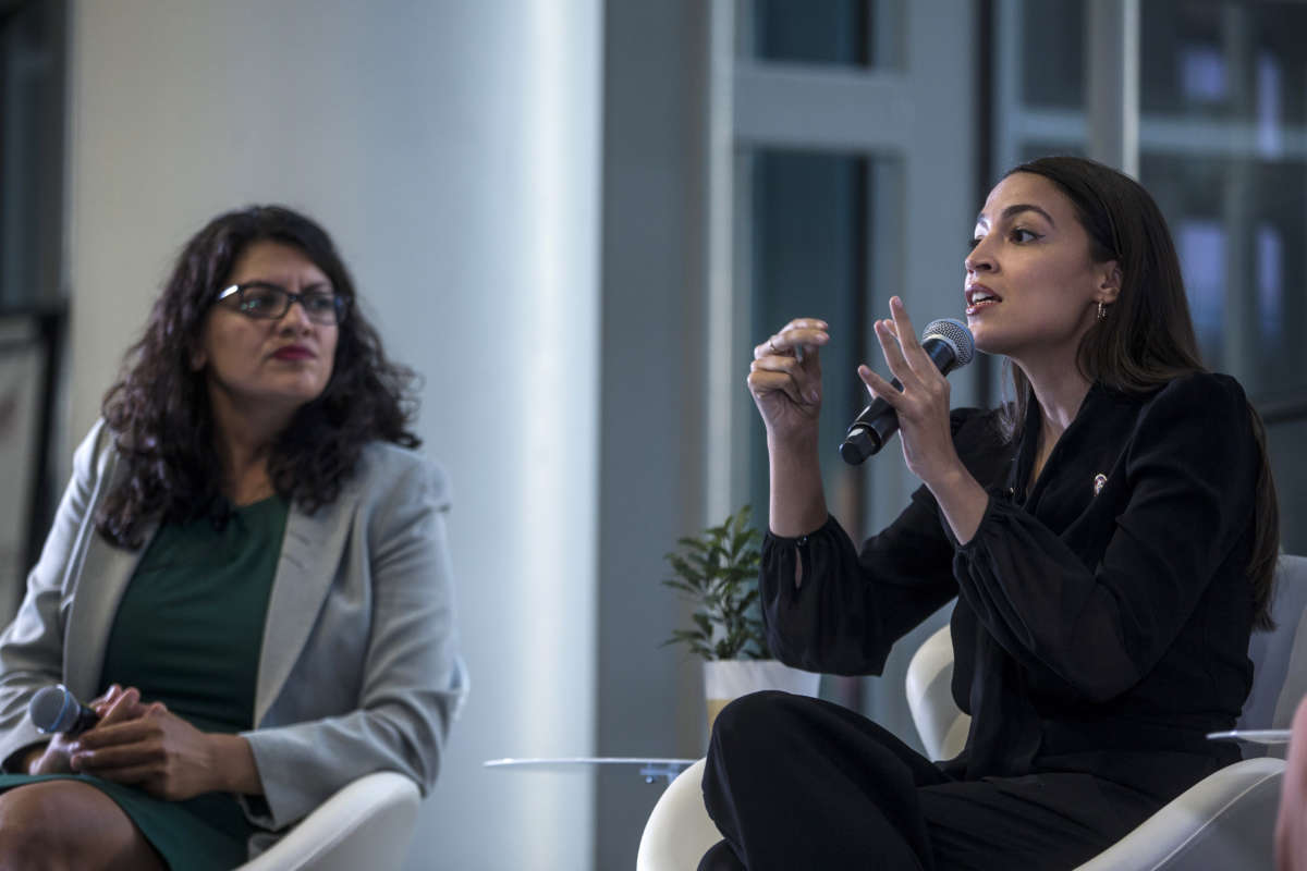 Rep. Alexandria Ocasio-Cortez speaks during a town hall hosted by the NAACP on September 11, 2019, in Washington, D.C. Also pictured is Rep. Rashida Tlaib.