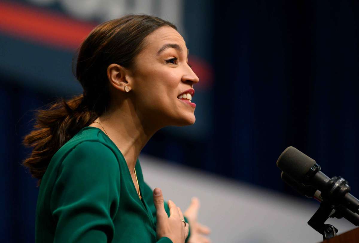 Rep. Alexandria Ocasio-Cortez takes the stage before speaking at the Climate Crisis Summit at Drake University on November 9, 2019, in Des Moines, Iowa.