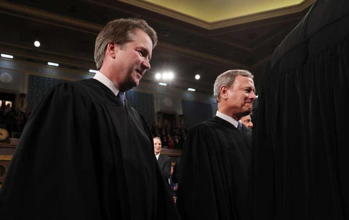 Supreme Court Associate Justice Brett Kavanaugh and Chief Justice John Roberts arrive to hear President Donald Trump deliver the State of the Union address in the House chamber on February 4, 2020, in Washington, D.C.