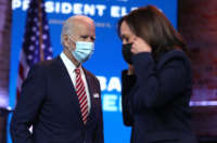 President-elect Joe Biden walks by Vice President-elect Kamala Harris as he prepares to deliver remarks about the U.S. economy during a press briefing at the Queen Theater on November 16, 2020, in Wilmington, Delaware.
