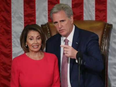 House Minority Leader Kevin McCarthy stands with Speaker of the House designate Nancy Pelosi before she is sworn in sworn in during the first session of the 116th Congress at the U.S. Capitol on January 3, 2019, in Washington, D.C.