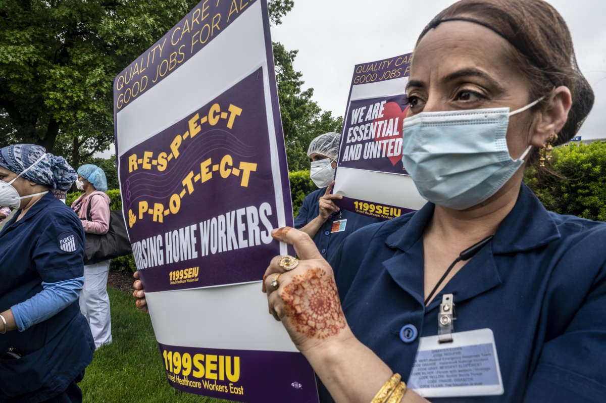 Employees at Parker Jewish Institute for Health Care and Rehabilitation in New Hyde Park, New York, during a vigil on May 28, 2020, protest their working conditions during the COVID-19 pandemic.