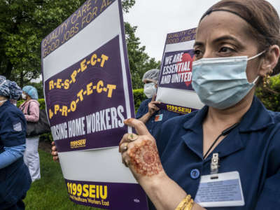 Employees at Parker Jewish Institute for Health Care and Rehabilitation in New Hyde Park, New York, during a vigil on May 28, 2020, protest their working conditions during the COVID-19 pandemic.