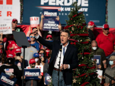 Sen. David Purdue speaks to the crowd during a rally with Vice President Mike Pence in support of himself and Sen. Kelly Loeffler on December 10, 2020, in Augusta, Georgia.