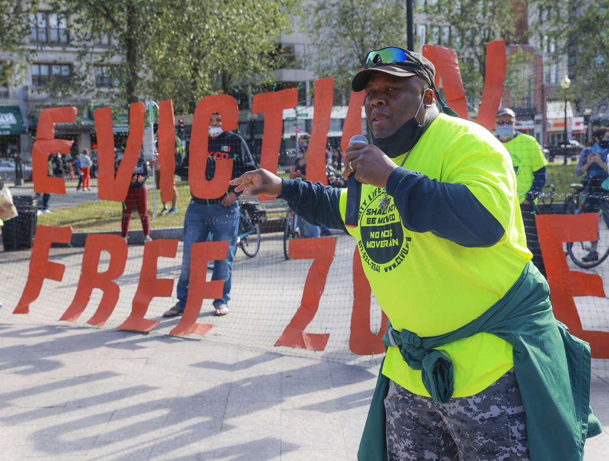 Ronel Remy, an organizer with City Life / Vida Urbana, speaks during a "Rally to Stop Evictions and Foreclosures" at the Brewer Fountain in Boston on October 11, 2020.