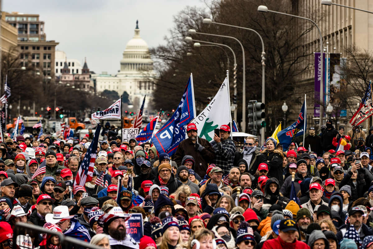 trump supporters march through the streets