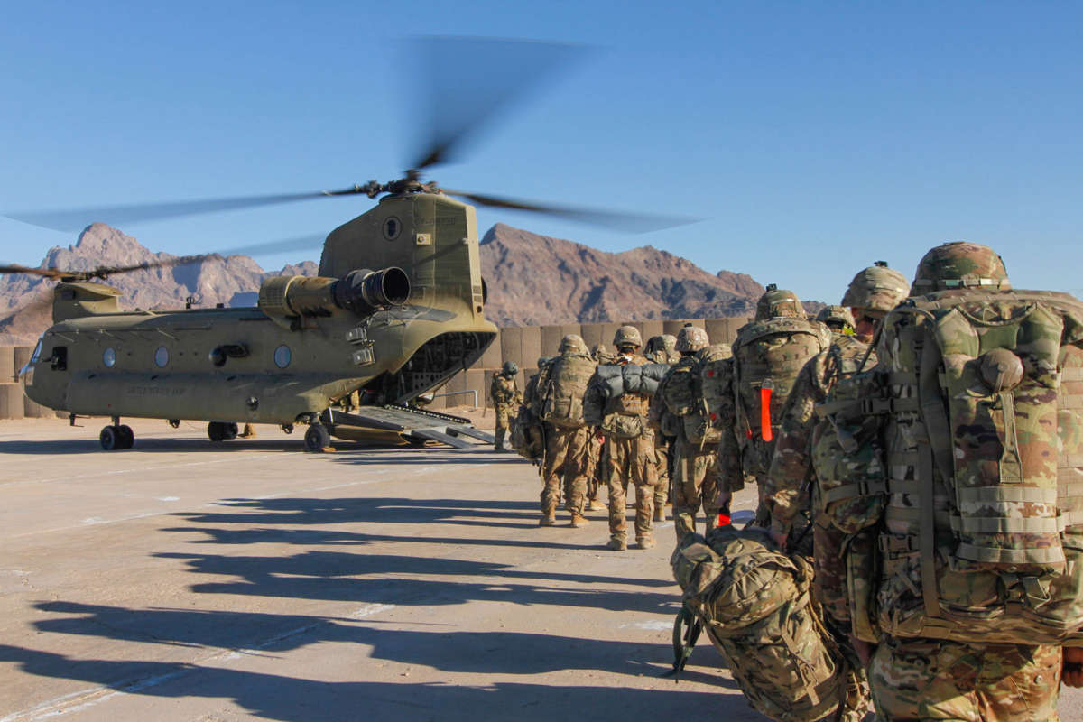 U.S. soldiers assigned to the 101st Resolute Support Sustainment Brigade load onto a Chinook helicopter to head out and execute missions across Afghanistan on January 15, 2019.