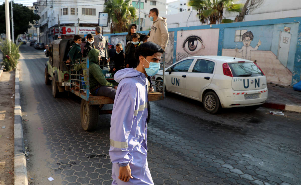 A UN employee, mask-clad due to the COVID-19 pandemic, is seen in Gaza City on November 10, 2020.