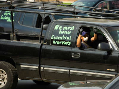 Day laborers and supporters hold a car protest in front of Pasadena City Hall to call on elected officials to support essential workers on Wednesday, April 29, 2020.