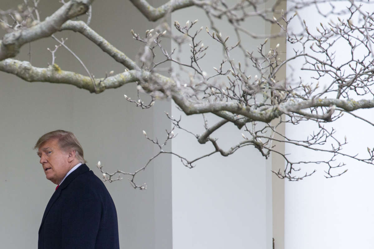 President Donald Trump walks to the Oval Office while arriving back at the White House on December 31, 2020, in Washington, D.C.
