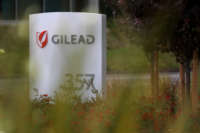 A sign is posted in front of the Gilead Sciences headquarters on April 29, 2020 in Foster City, California.