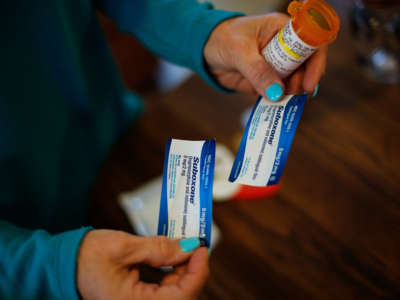 Susan Stevens shows off a prescription for Suboxone at her home in Lewisville, North Carolina, on March 11, 2019.