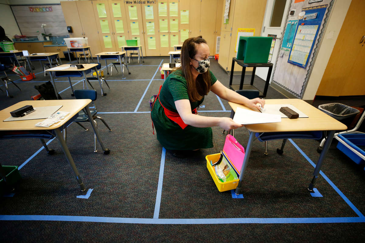 Alta Vista Elementary School kindergarten teacher Bridget Vorland prepares the classroom before students arrive as Redondo Beach Unified School district has welcomed back some of its K-2 students this week through a waiver. Alta Vista Elementary School on Tuesday, Feb. 2, 2021 in Redondo Beach, CA.