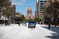 The Texas Capitol building is surrounded by snow on February 15, 2021.